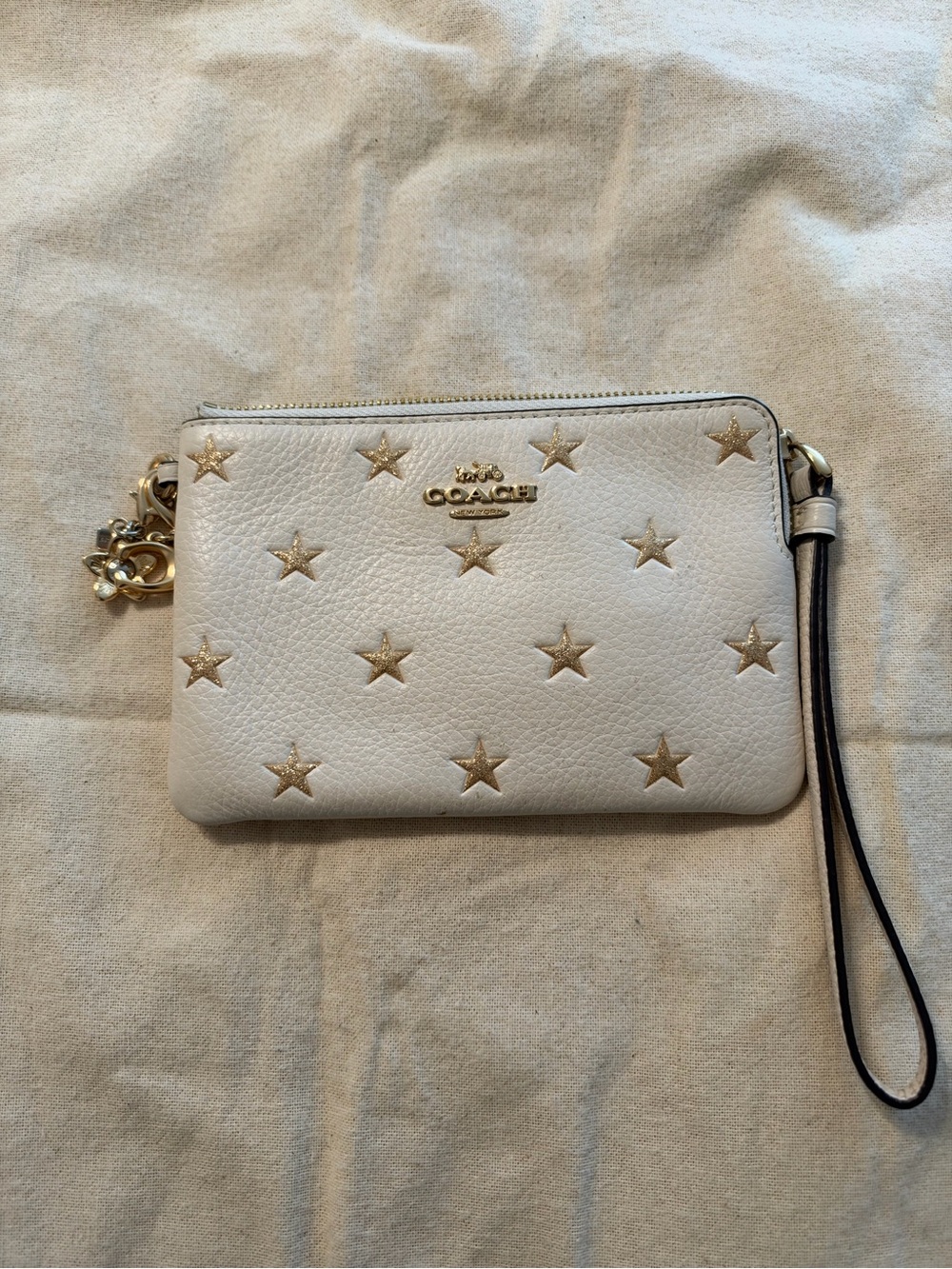COACH White Pebbled Leather Wristlet Gold Glitter Star Print + Coach Charms